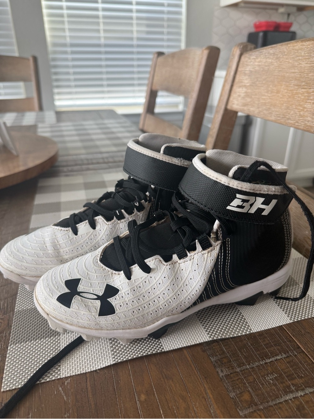Under Armour Kids White and Black High-Top Athletic Cleats